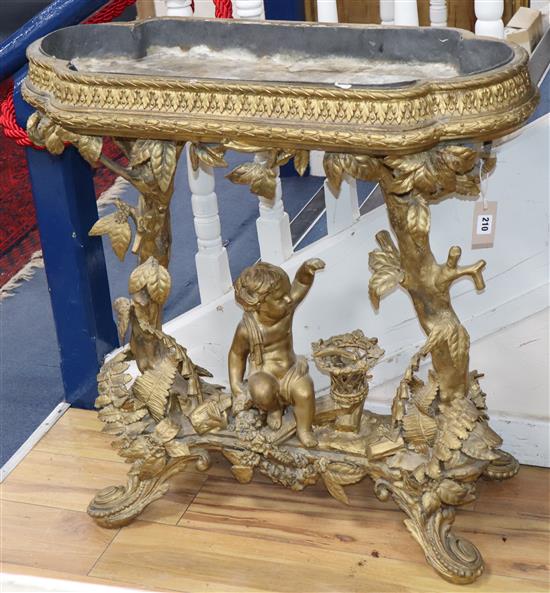 A Victorian carved giltwood and gesso jardinière table, child and trees underframe, W.83cm